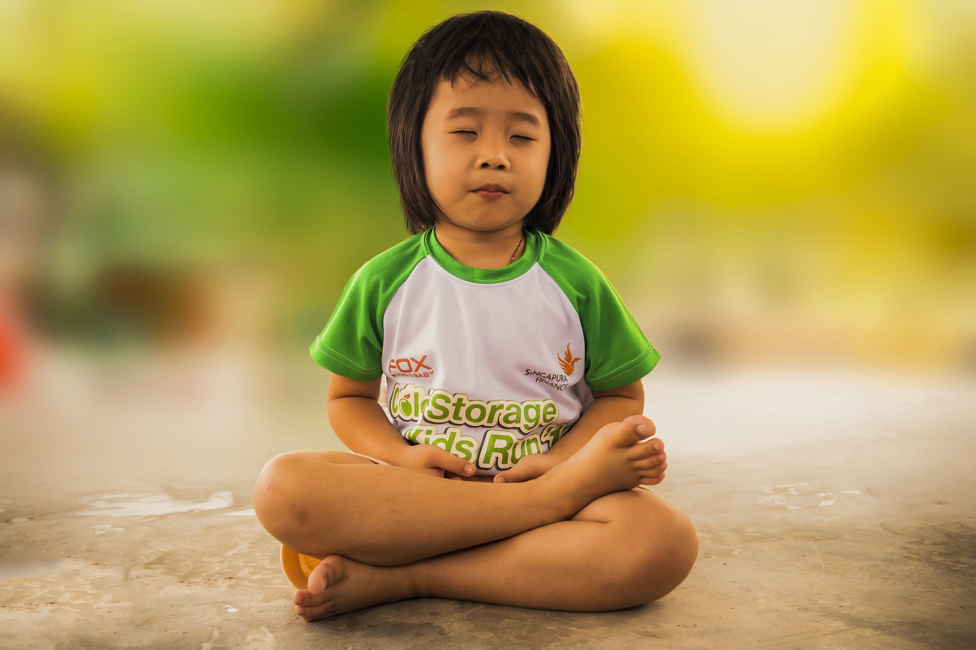 child meditating, inhaling on the count of four, holding the breath on the count of seven, exhaling on the count of eight.